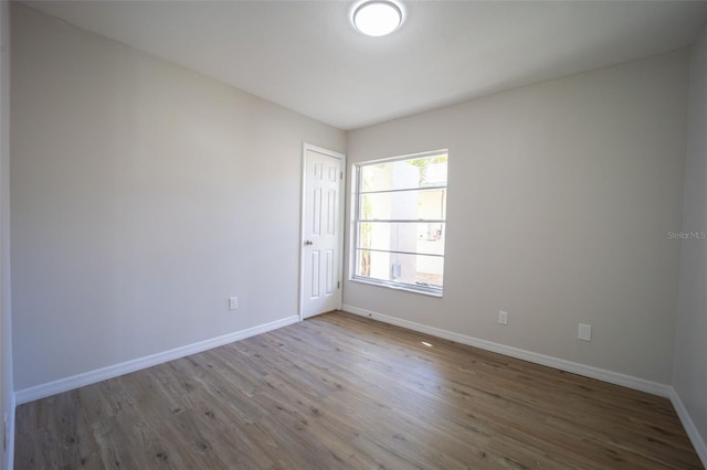 spare room featuring hardwood / wood-style floors