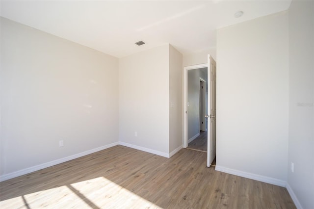 spare room with light wood-type flooring