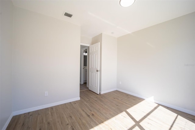 empty room with light wood-type flooring