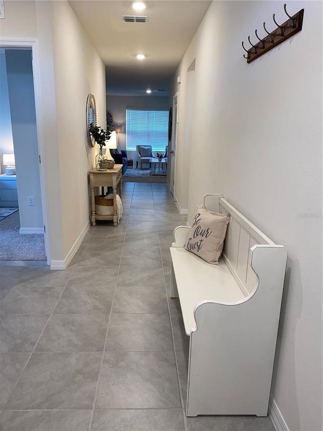 310 Gardenia Ct, Poinciana, FL 34759 - hall featuring baseboards and concrete flooring