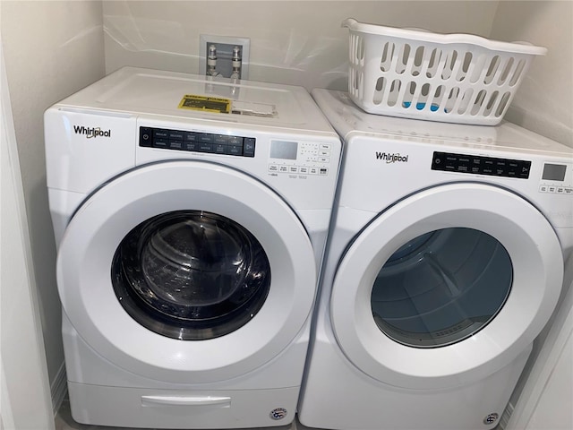 310 Gardenia Ct, Poinciana, FL 34759 - laundry room featuring washing machine and dryer