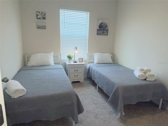 bedroom with light colored carpet