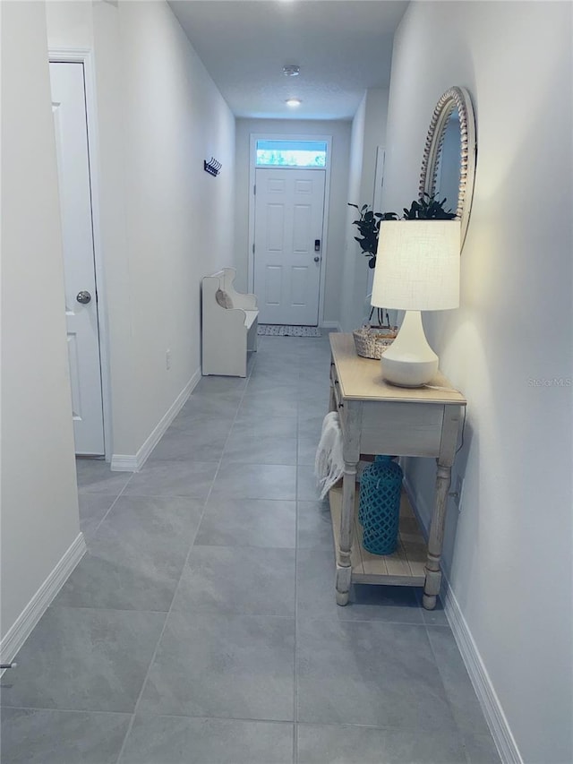 310 Gardenia Ct, Poinciana, FL 34759 - foyer entrance featuring baseboards