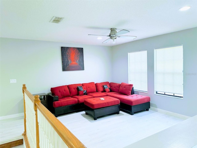 living room featuring ceiling fan