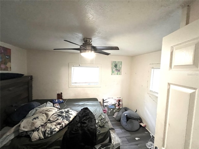 bedroom featuring ceiling fan and wood-type flooring