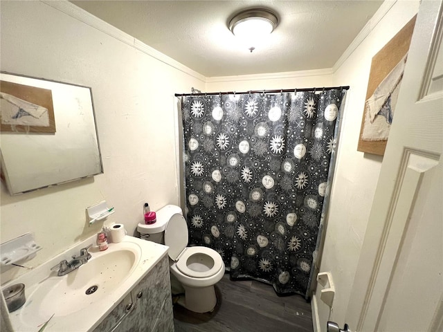 bathroom with a shower with shower curtain, a textured ceiling, crown molding, hardwood / wood-style floors, and toilet