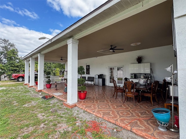 view of patio with french doors and ceiling fan