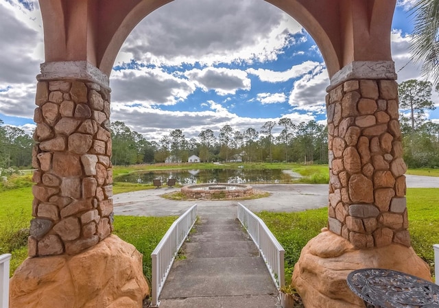 view of community with a water view