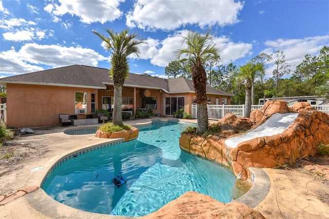 view of swimming pool with a patio