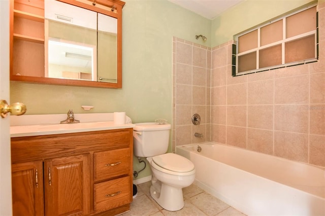 full bathroom with tile patterned flooring, vanity, toilet, and tiled shower / bath