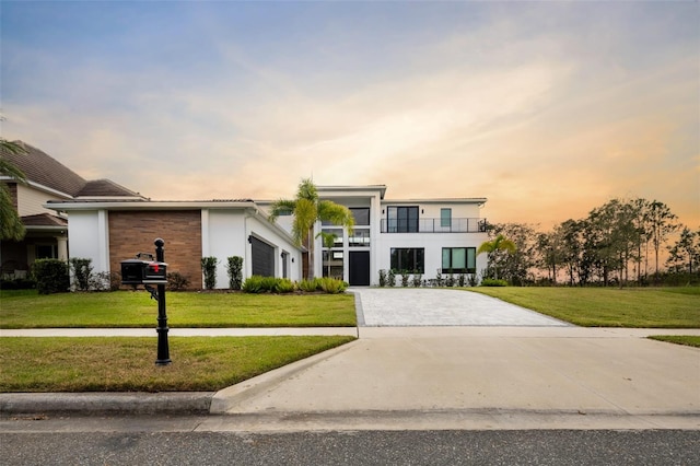 contemporary house with a lawn