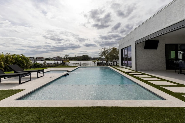 view of swimming pool with a patio area