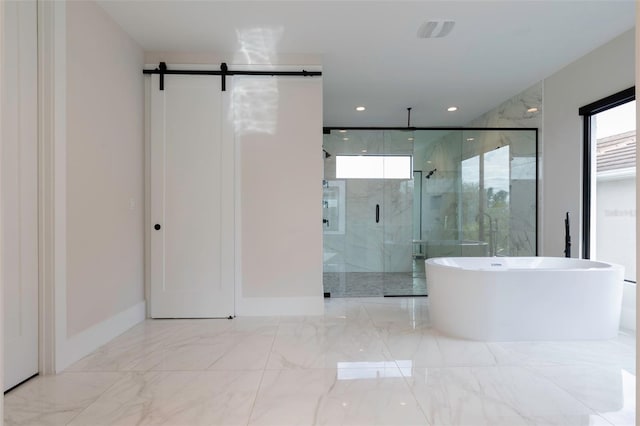 bathroom featuring independent shower and bath