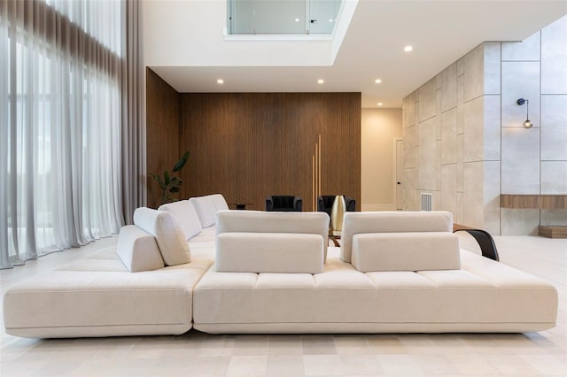 15614 Espalier Way, Winter Garden, FL 34787 - home theater room featuring a towering ceiling, wooden walls, an accent wall, and recessed lighting