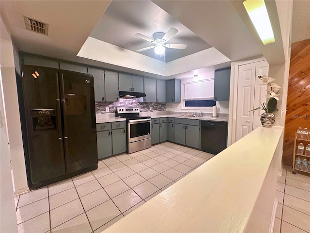 kitchen with ceiling fan, sink, tasteful backsplash, light tile patterned floors, and black appliances