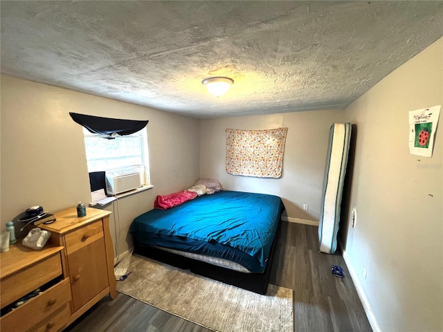 bedroom featuring dark hardwood / wood-style floors and cooling unit