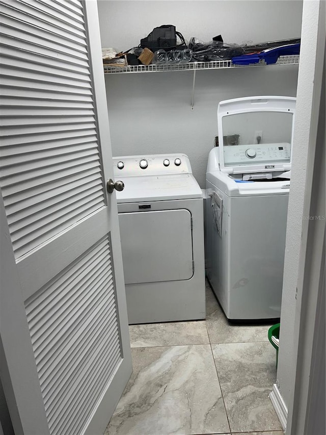 laundry room with washer and clothes dryer