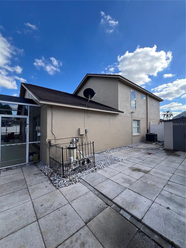 back of property with a patio area