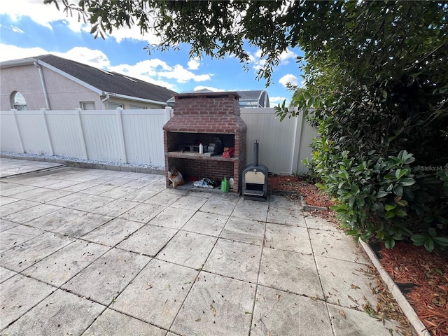 view of patio / terrace with a fireplace