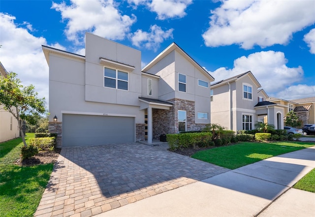 view of front facade with a front yard and a garage