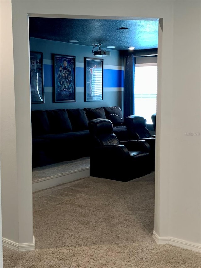 carpeted living room with a textured ceiling