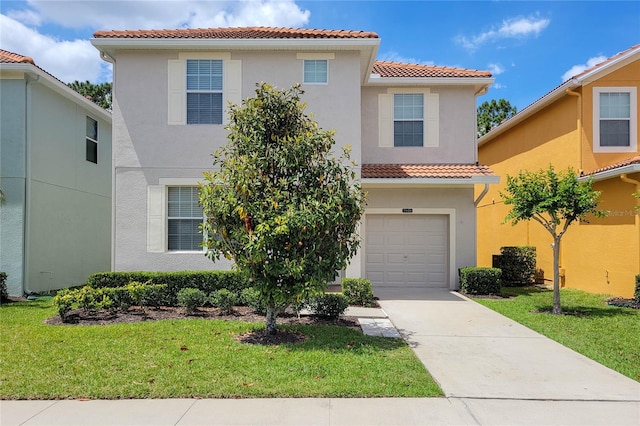 mediterranean / spanish-style home with a front lawn and a garage