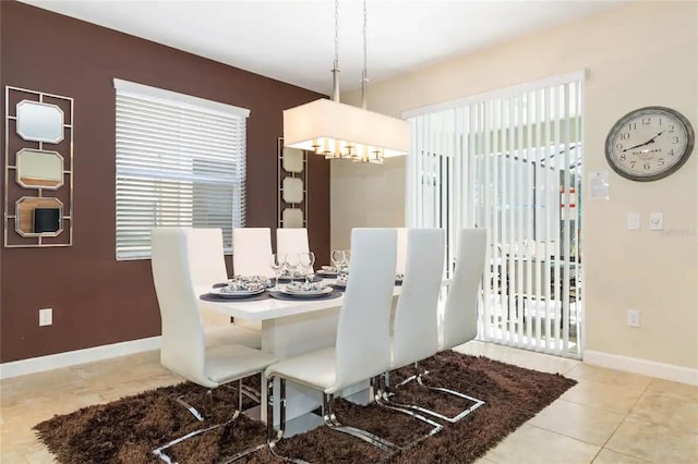 dining space featuring tile patterned flooring