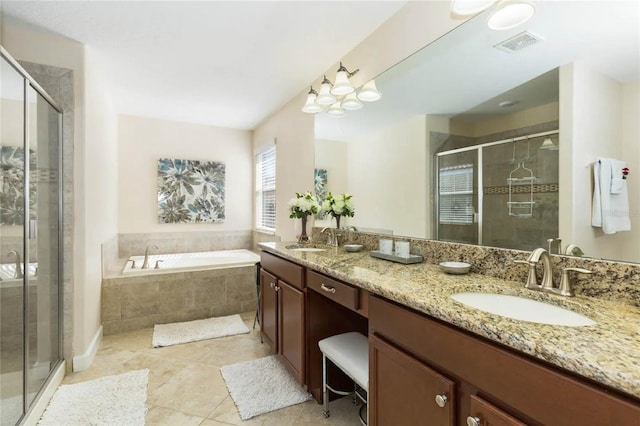 bathroom featuring tile patterned floors, separate shower and tub, and vanity