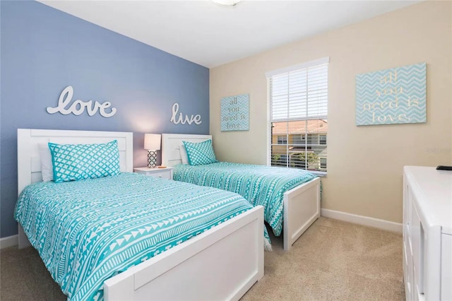 bedroom with light colored carpet