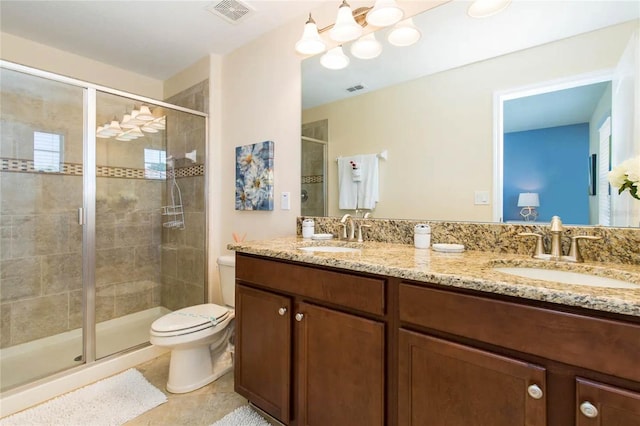 bathroom featuring walk in shower, tile patterned flooring, vanity, and toilet