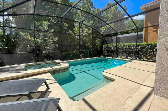 view of pool featuring a lanai, an in ground hot tub, and a patio