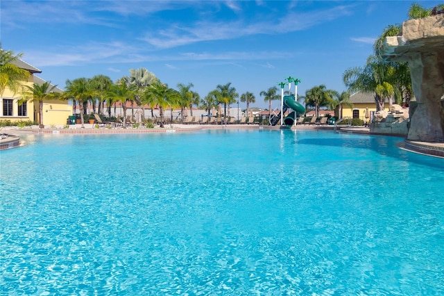 view of swimming pool with a water slide