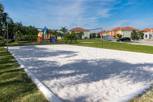 view of jungle gym with a yard and volleyball court