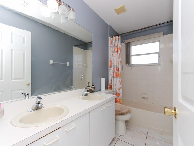 full bathroom featuring tile patterned flooring, vanity, toilet, and shower / tub combo