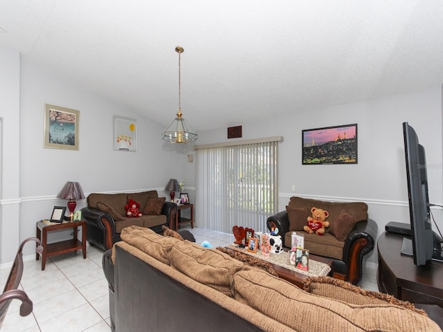 living room featuring lofted ceiling and light tile patterned floors