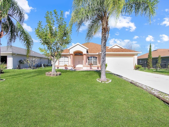 ranch-style home featuring a front lawn and a garage