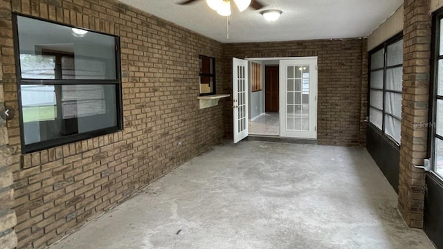 interior space featuring ceiling fan and french doors