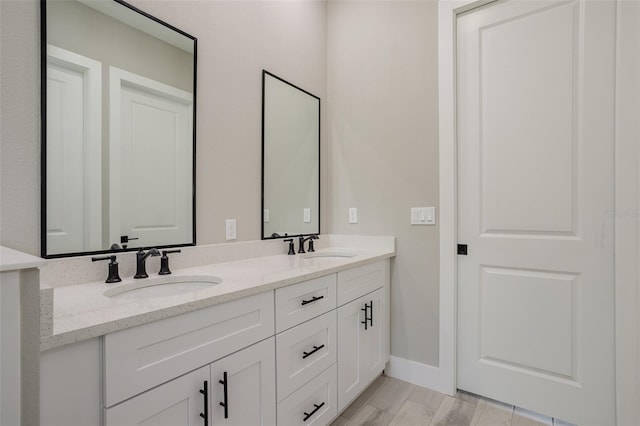 bathroom featuring hardwood / wood-style flooring and vanity