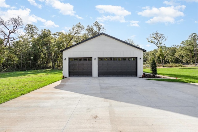 garage featuring a lawn