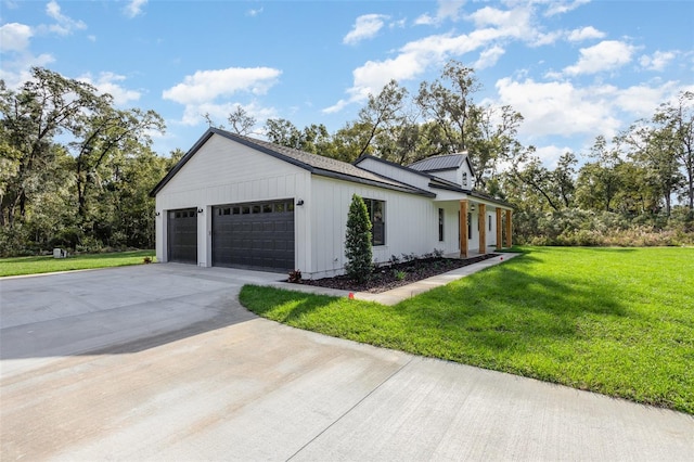 view of side of home with a garage and a yard