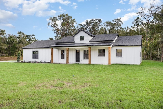 modern inspired farmhouse featuring a front lawn and a porch