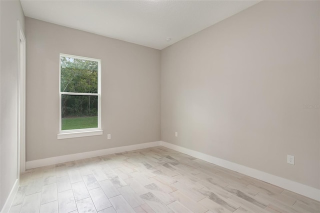 unfurnished room with light wood-type flooring