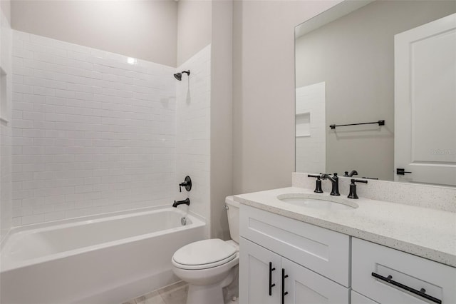 full bathroom featuring tiled shower / bath combo, toilet, and vanity