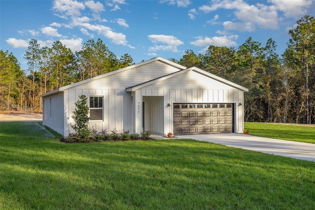 view of front of property featuring a garage and a front lawn