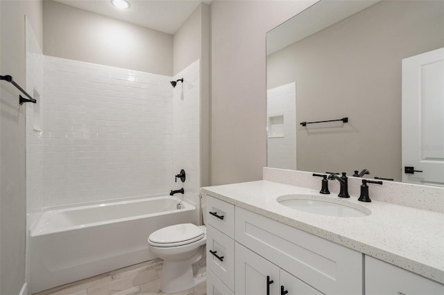 full bathroom featuring vanity, toilet, and tiled shower / bath