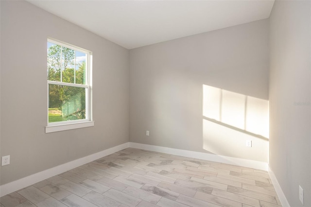 spare room featuring light hardwood / wood-style flooring