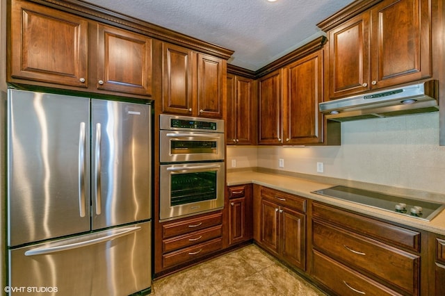 kitchen featuring a textured ceiling and stainless steel appliances