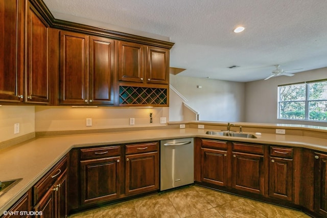 kitchen featuring kitchen peninsula, a textured ceiling, ceiling fan, sink, and dishwasher