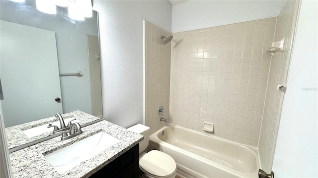 full bathroom with vanity, toilet, and tiled shower / bath