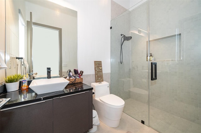 bathroom with tile patterned floors, toilet, an enclosed shower, and vanity